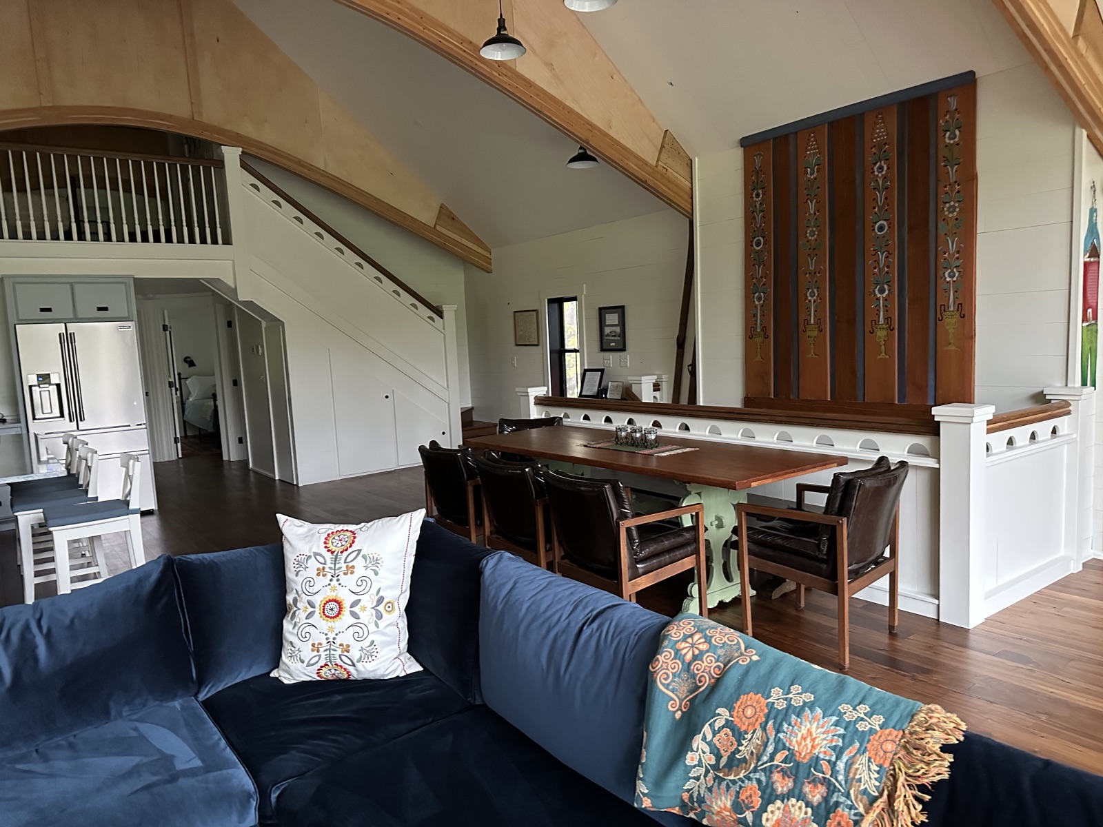 Barnhouse dining hall with carved panels and stairs