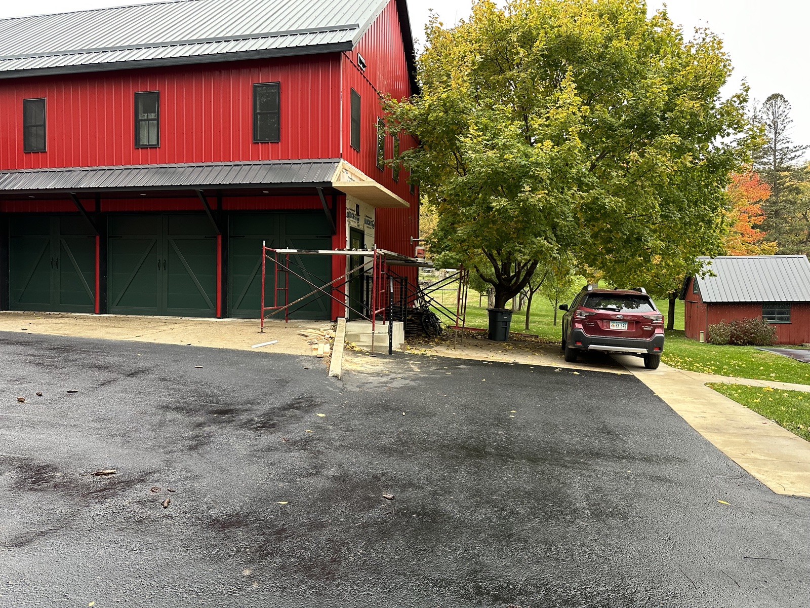 Red barn exterior during scaffolding phase