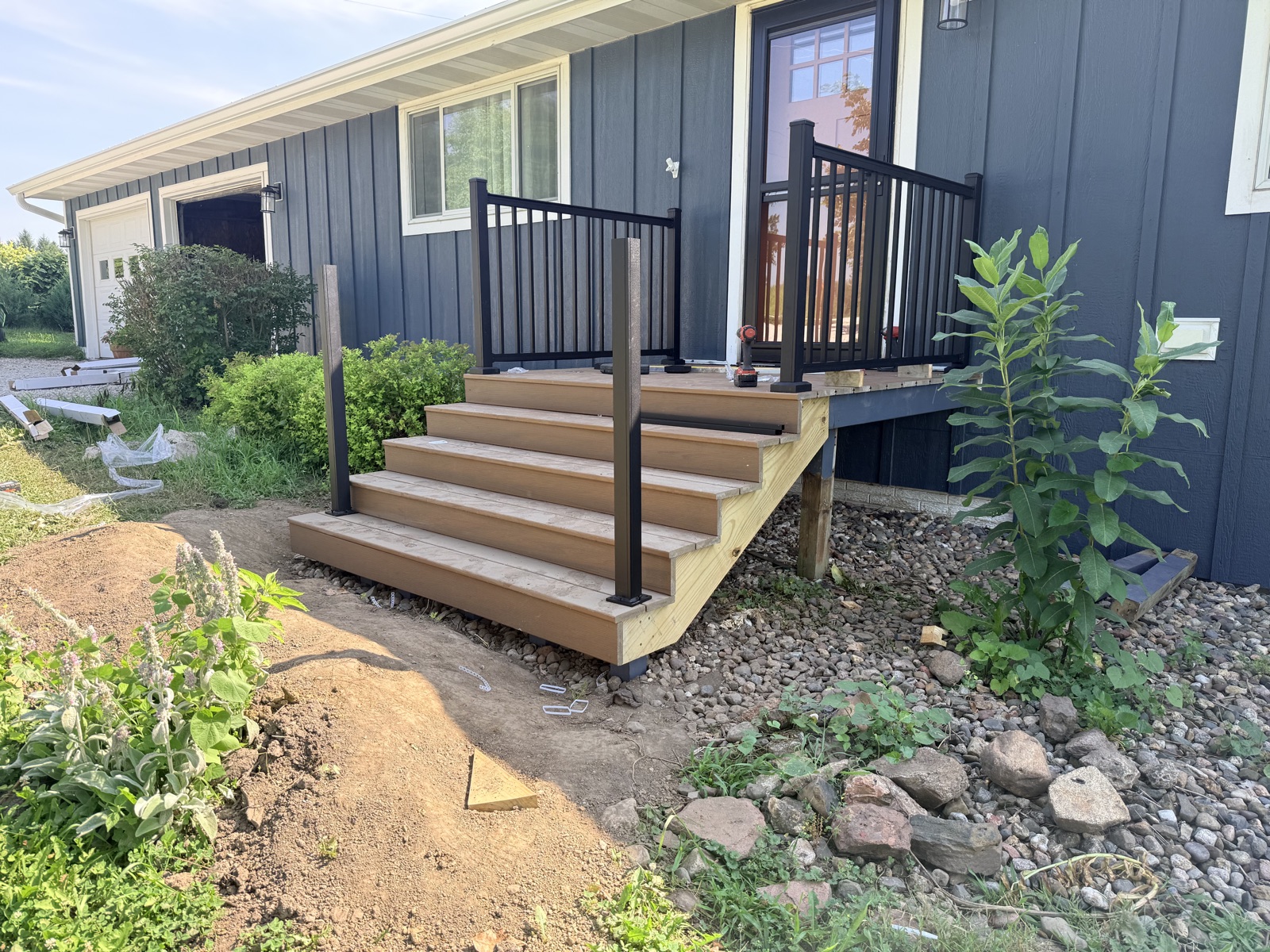 Deck stairs with black railings
