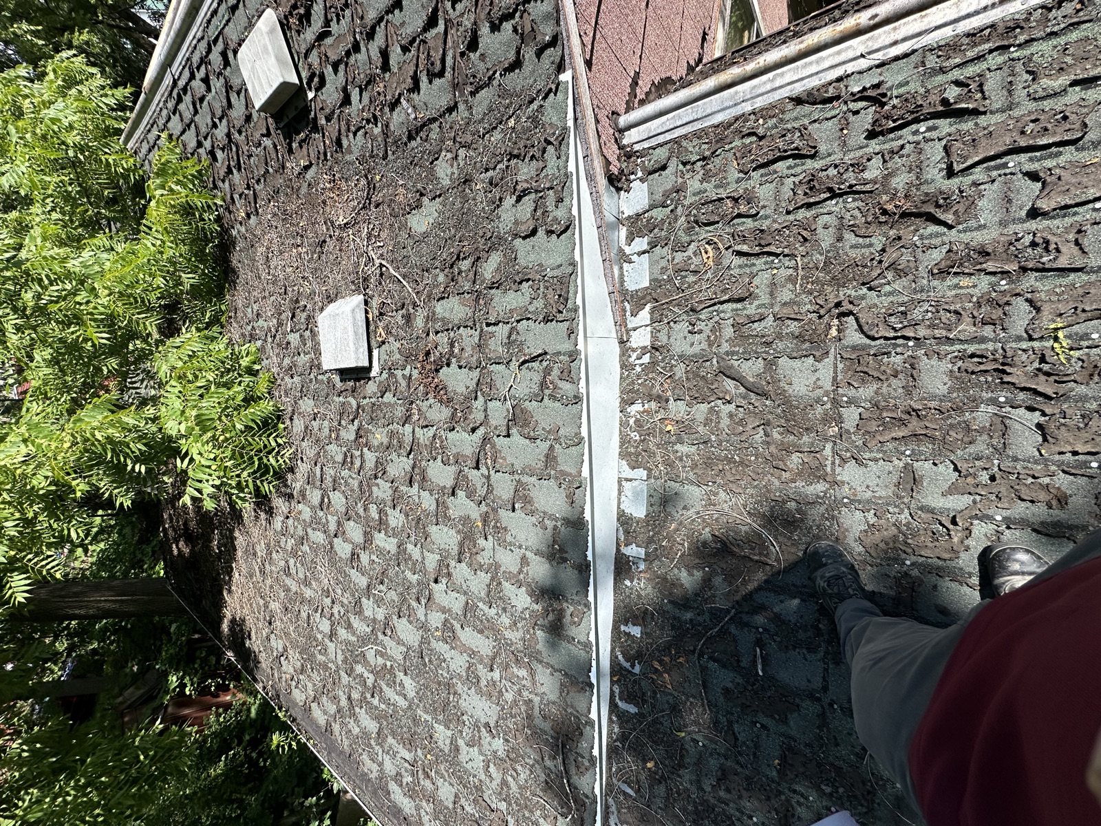 Rusted gutter close-up before replacement